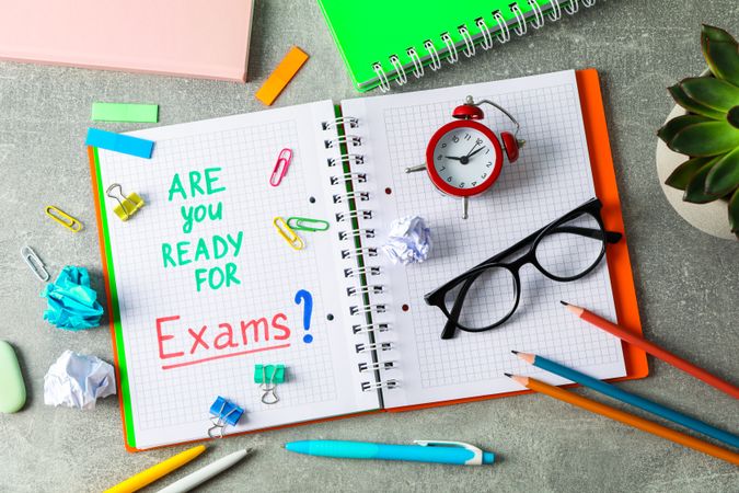 Composition with school supplies on grey background, top view