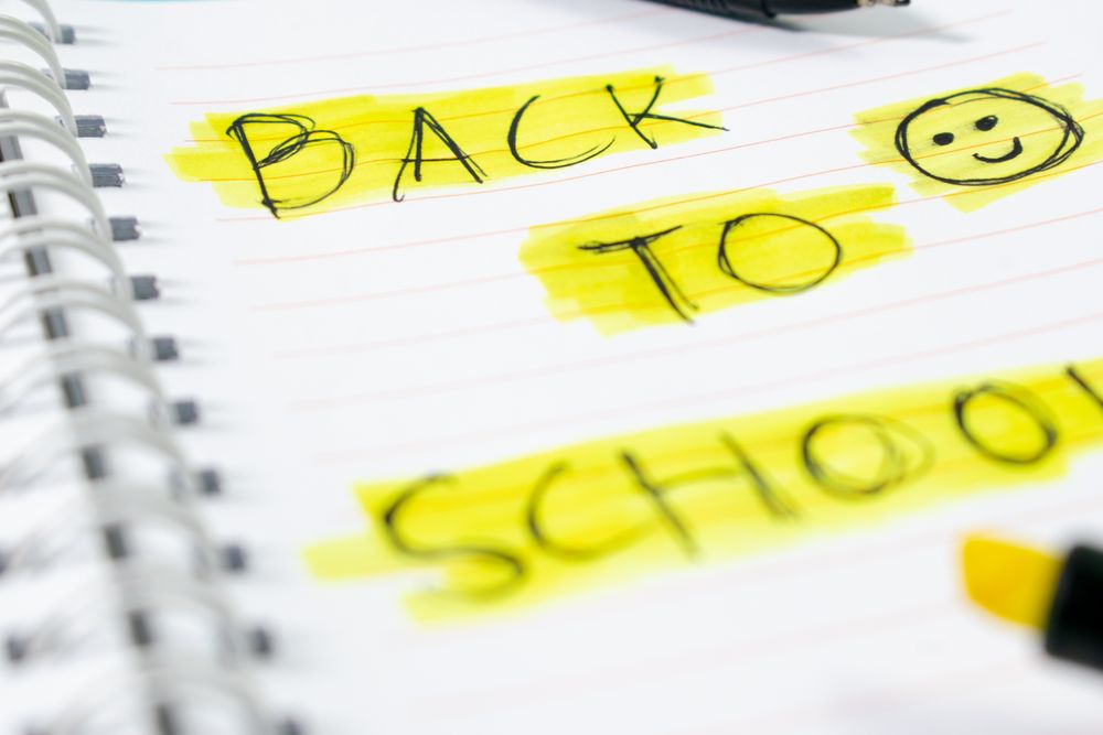 Notebook with writing Back to School with green stabilo