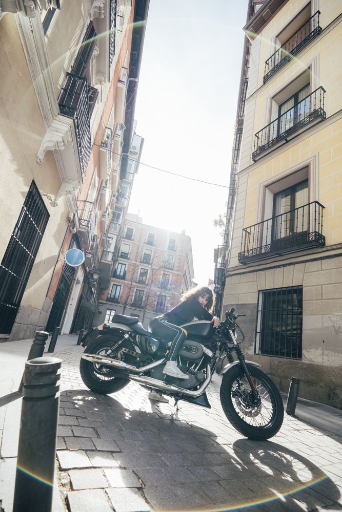 Young woman in custom motorbike