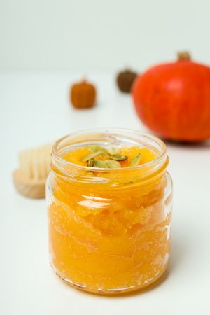 Skin care and face care concept - pumpkin cosmetic