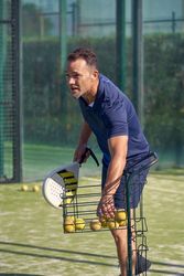 Man taking ball for padel game