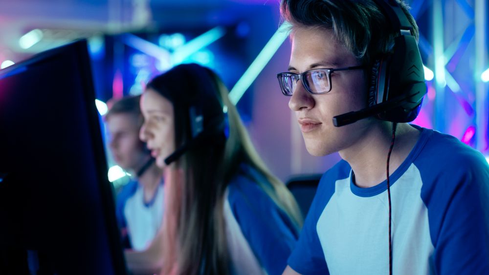 Team of Gamers Play in Multiplayer  Video Game on a eSport Tournament.