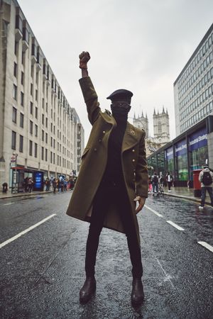 London, England, United Kingdom - June 6th, 2020: Sharply dressed man making raised fist