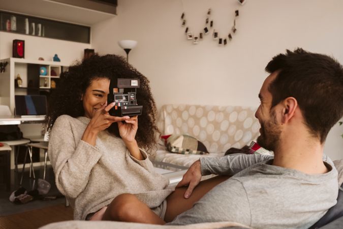 Black woman taking picture of boyfriend