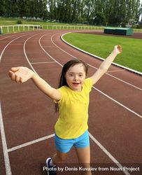 Happy child jogging around running track 4dEDdb