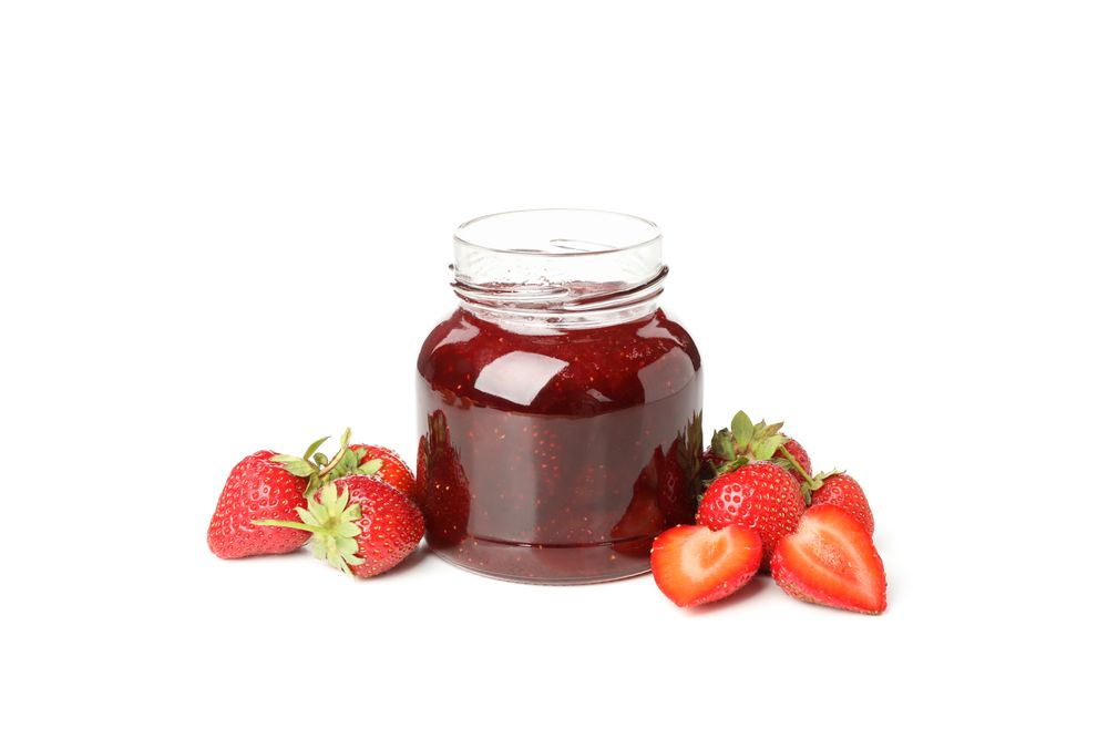 Delicious strawberry jam isolated on blank background