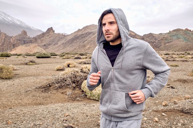 Male athlete running in mountains