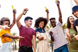 Group of happy adult having fun at summer party with beer