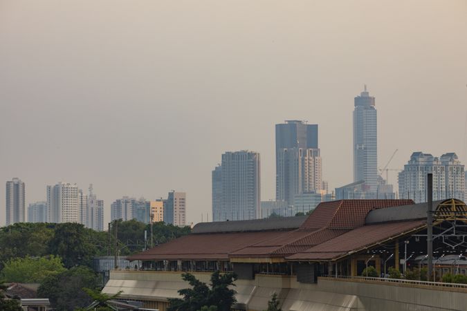 Jakarta, Indonesia - Oct 19, 2019: The Gondangdia train station and the cityscape of Jakarta