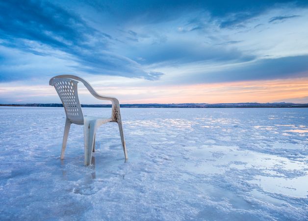 Chair on salt mine during sunset