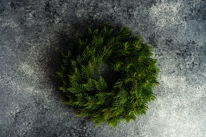 Plain Christmas wreath on the stone background with copy space