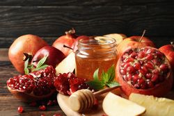 Autumn fruits arranged on a wooden table with dark background