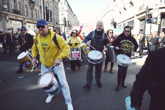 London, England, United Kingdom - March 19 2022: Men playing drums at protest