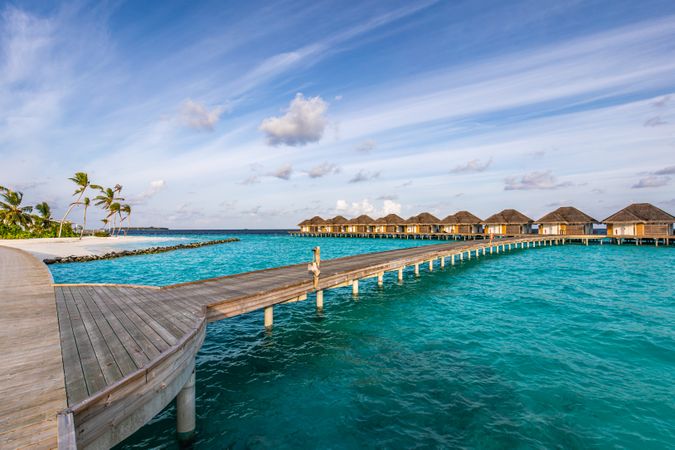 Bridge from beach to overwater bungalows