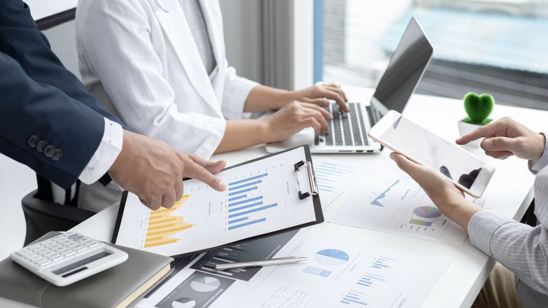 Business Team Meeting and Data Presentation