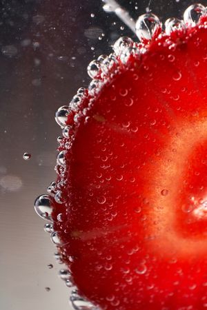 Slice of strawberry in fresh drink