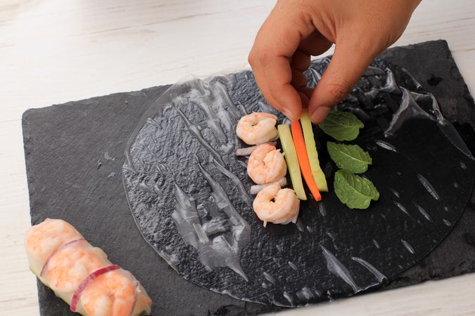 Spring rolls being made on board