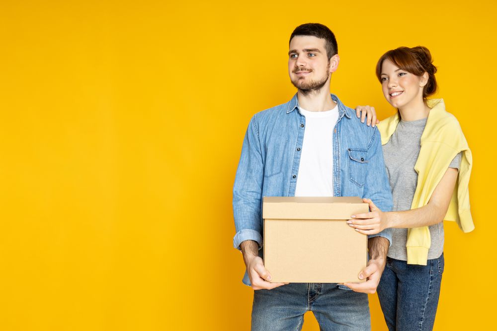 Concept of move with a happy young couple