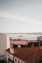 View of buildings roofs and sea