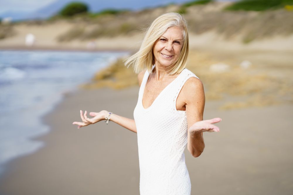 Incredulous mature woman with her arms making questioning gesture