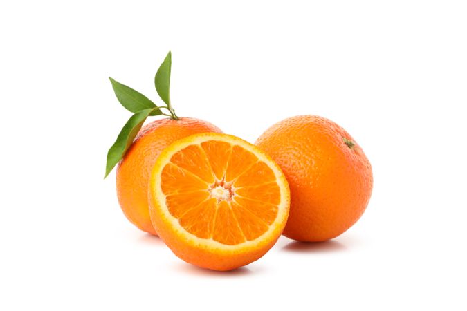 Group of ripe mandarins isolated on light background