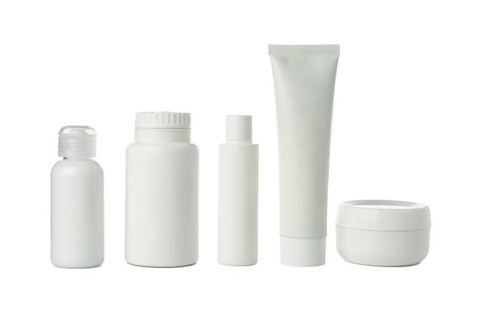 Blank bottles for cosmetics isolated on light background