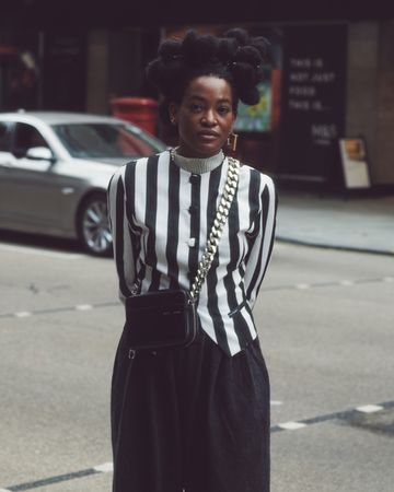 London, England, United Kingdom - September 18 2021: Black woman in striking monochrome outfit