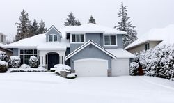 Falling snow with Pacific Northwest home