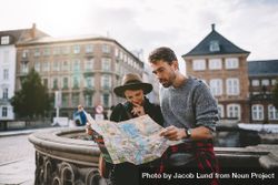 Young couple looking at a navigation map of old European city 5oW8y5