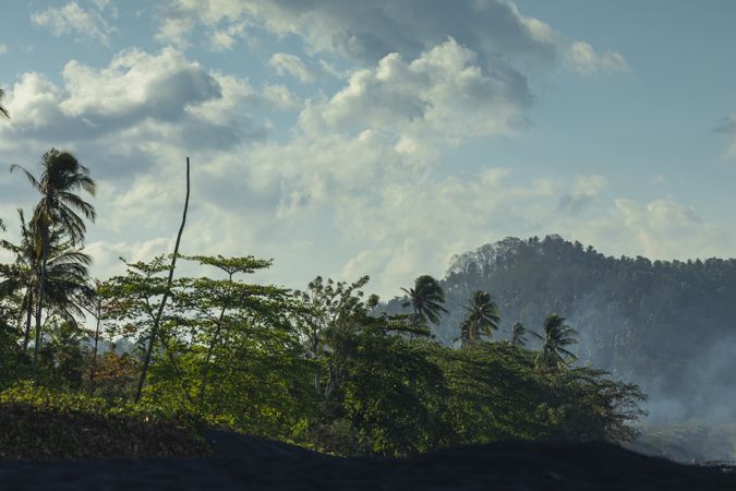 Sunset over the rainforests of Tangkoko National Park, seen from Batu Puti Beach, Indonesia