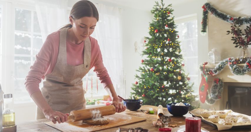 Portrait of Female Chef Preparing Dough and Making Gingerbread for Christmas at Home.