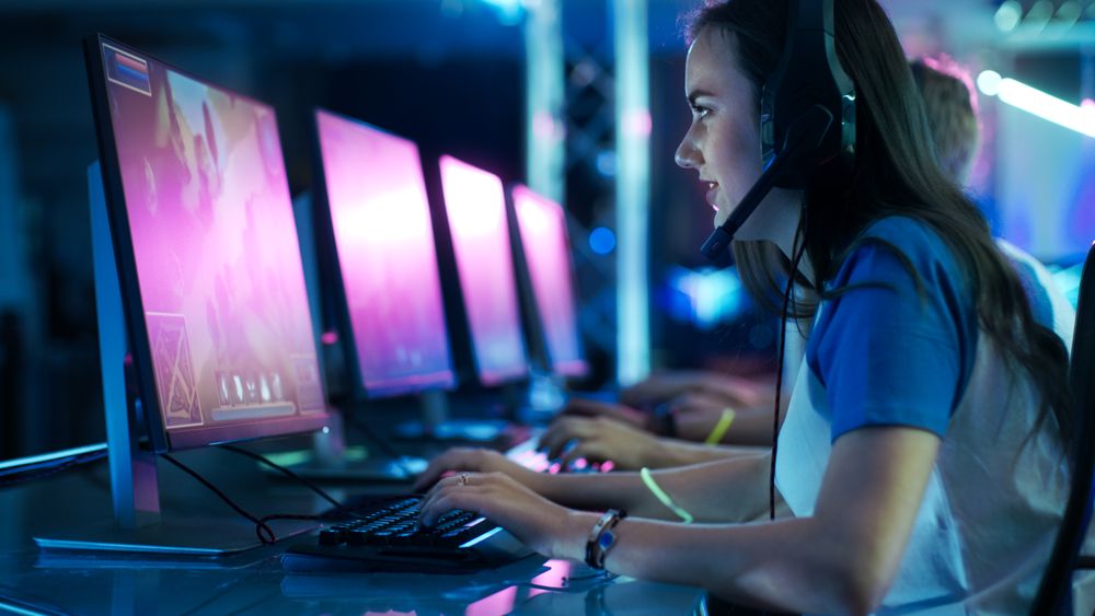 Team of Professional eSport Gamers Playing Competitive  MMORPG/ Strategy Video Game on a Cyber Games Tournament.