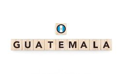 Wooden blocks bearing the name and flag of Guatemala. Guatemalan and Caribbean Culture, national identity, travel, and geography in a copy space design.