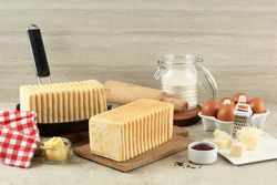 Two loads of bread with eggs, cheese and flour