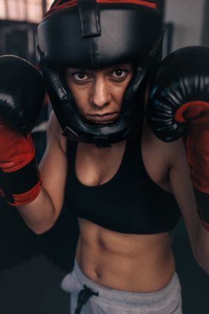 Female boxer geared up for a fight