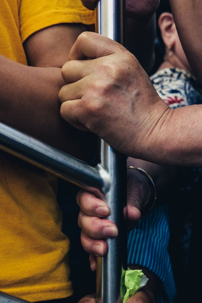 Person holding silver pole
