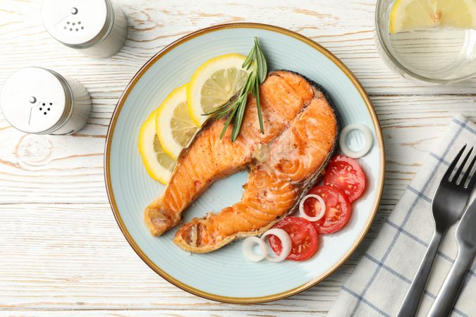 Composition with tasty grilled salmon on wooden background, top view