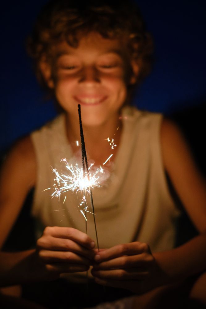 Delighted boy with Bengal lights