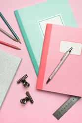 School stationery set on pink background