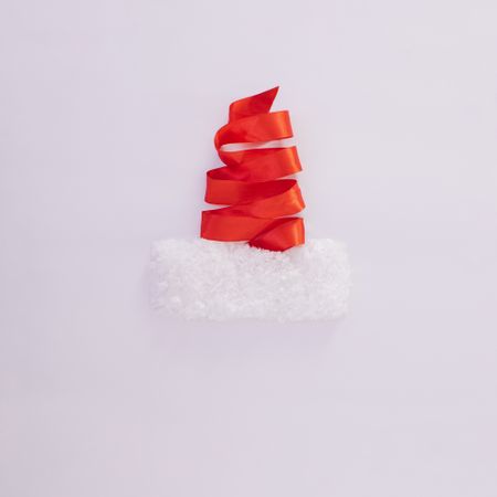 Red ribbon making Santa hat