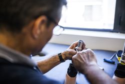 man fixing a prosthesis in a workshop