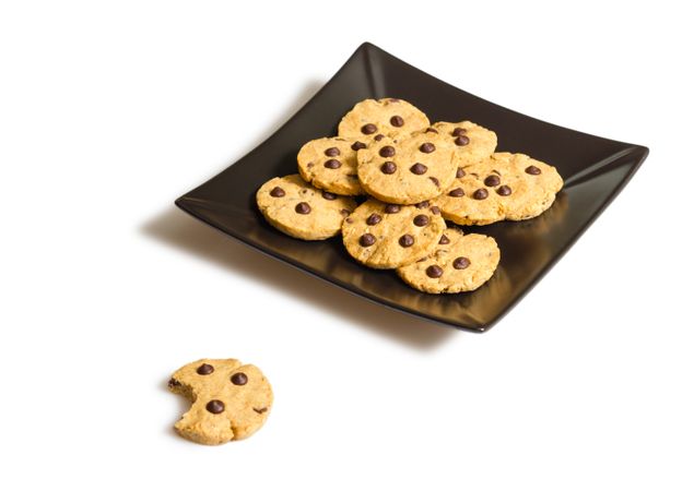 Chocolate chip cookies on a plate isolated on studio background