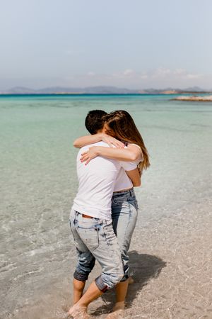 Amorous couple bonding in sea water