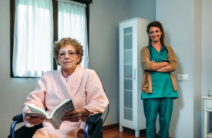 Patient posing with doctor in the background