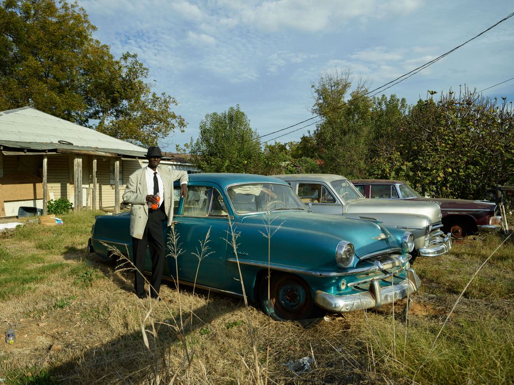 Andrew Ben Williams enjoys a soda after church in tiny Glendora, Mississippi
