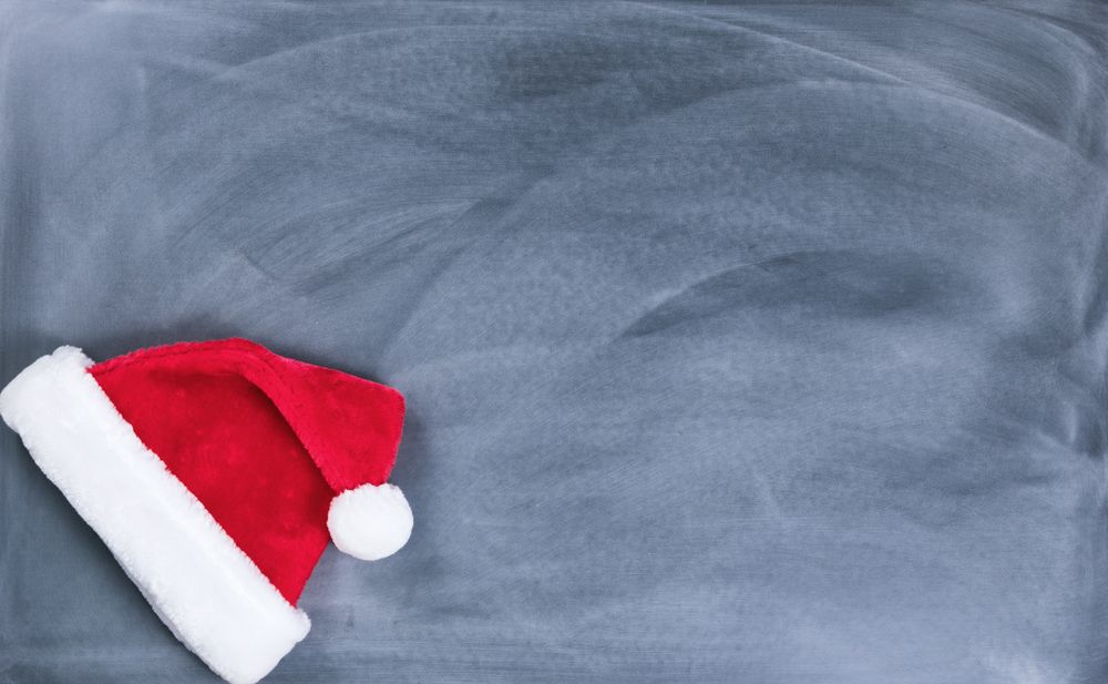 Erased chalkboard with Santa cap in lower left corner