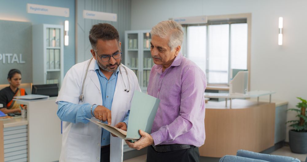 Indian Healthcare Service: Professional Medical Doctor Talking to His Patient, Sharing Good News about Health Treatment.
