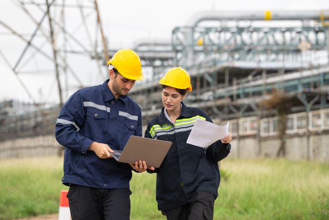 Engineer worker checking project at petrochemical factory or refinery oil plant industrial.