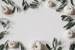 Paper with frame of decorative pumpkins and branches