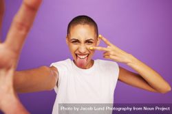 Portrait of expressive woman posing on purple background 0PaWe5